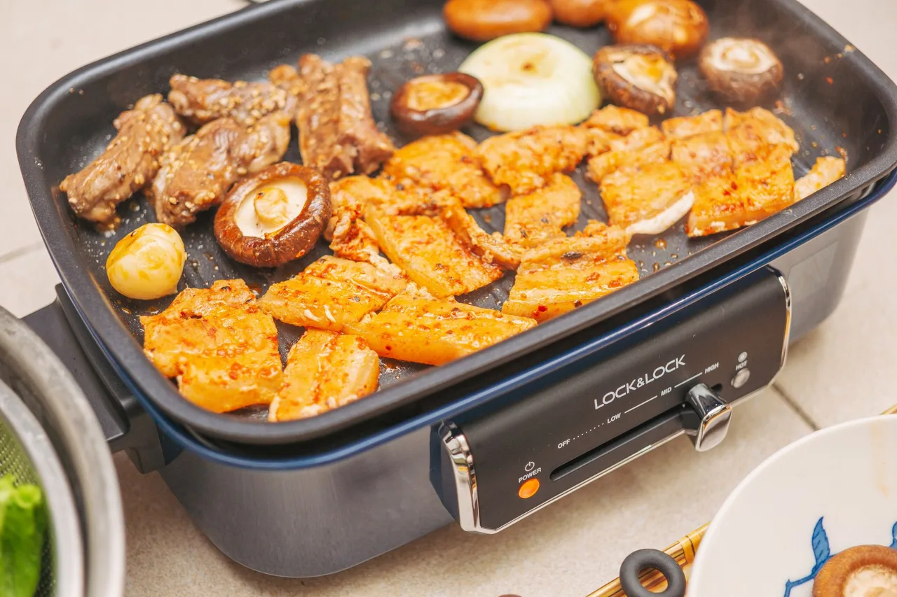Samgyeopsal pork grilling on a Korean BBQ table