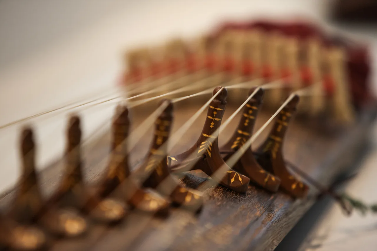 A musician playing the gayageum, a Korean zither