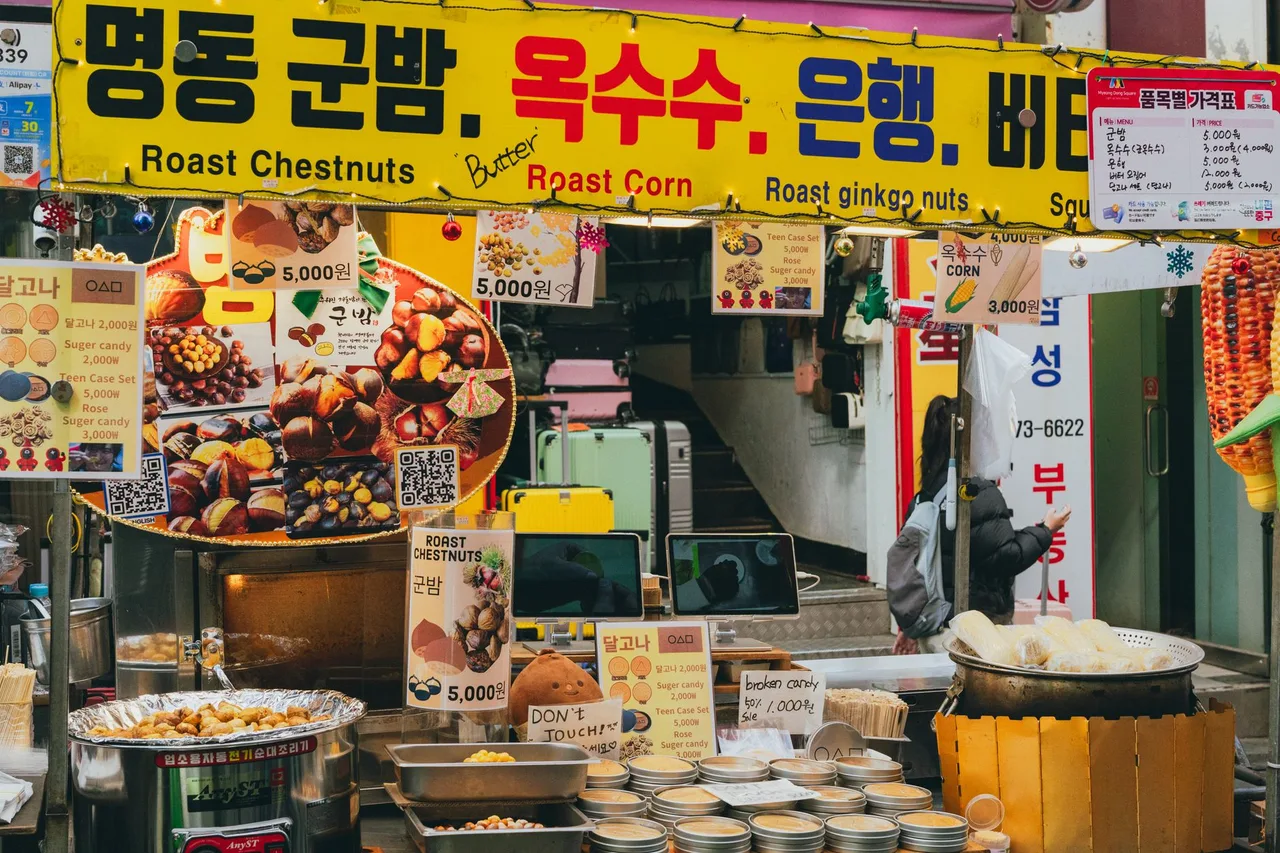 Street food carts lining Myeongdong after dark