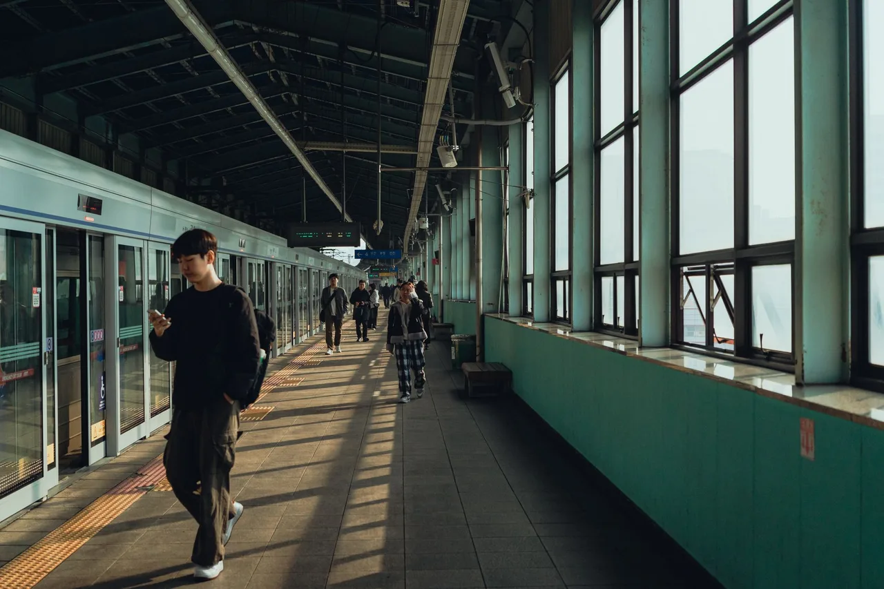 A Seoul subway train pulling into a platform