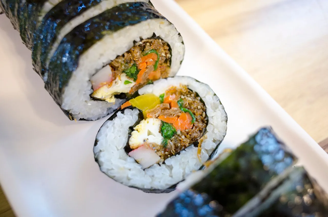 Mini mayak gimbap rolls served with a mustard dip