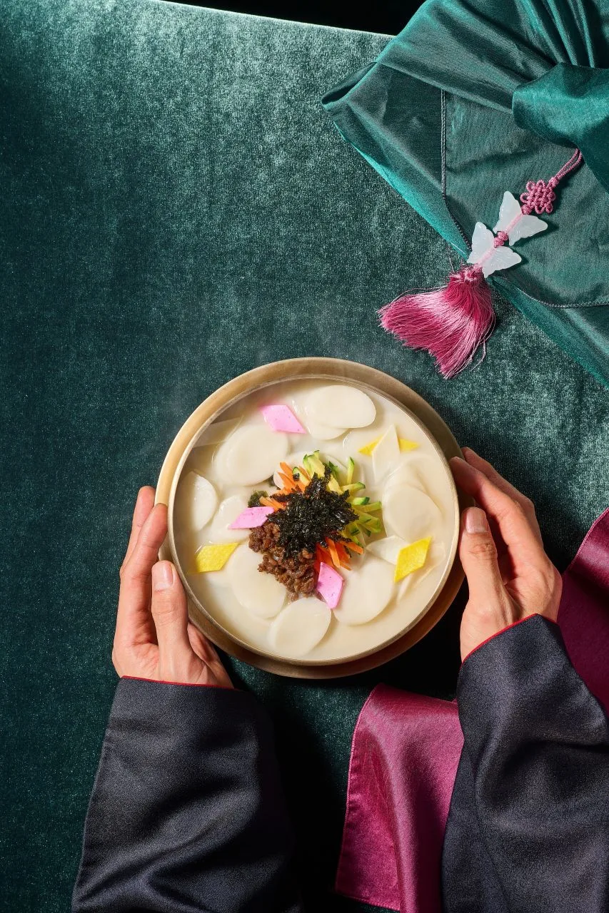 A steaming bowl of tteokguk, the rice cake soup eaten on Seollal morning