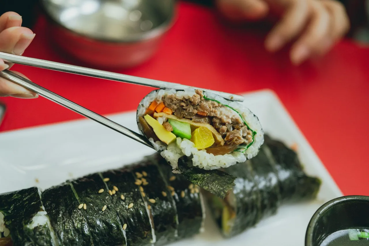 Rolls of vegetable gimbap sliced on a plate