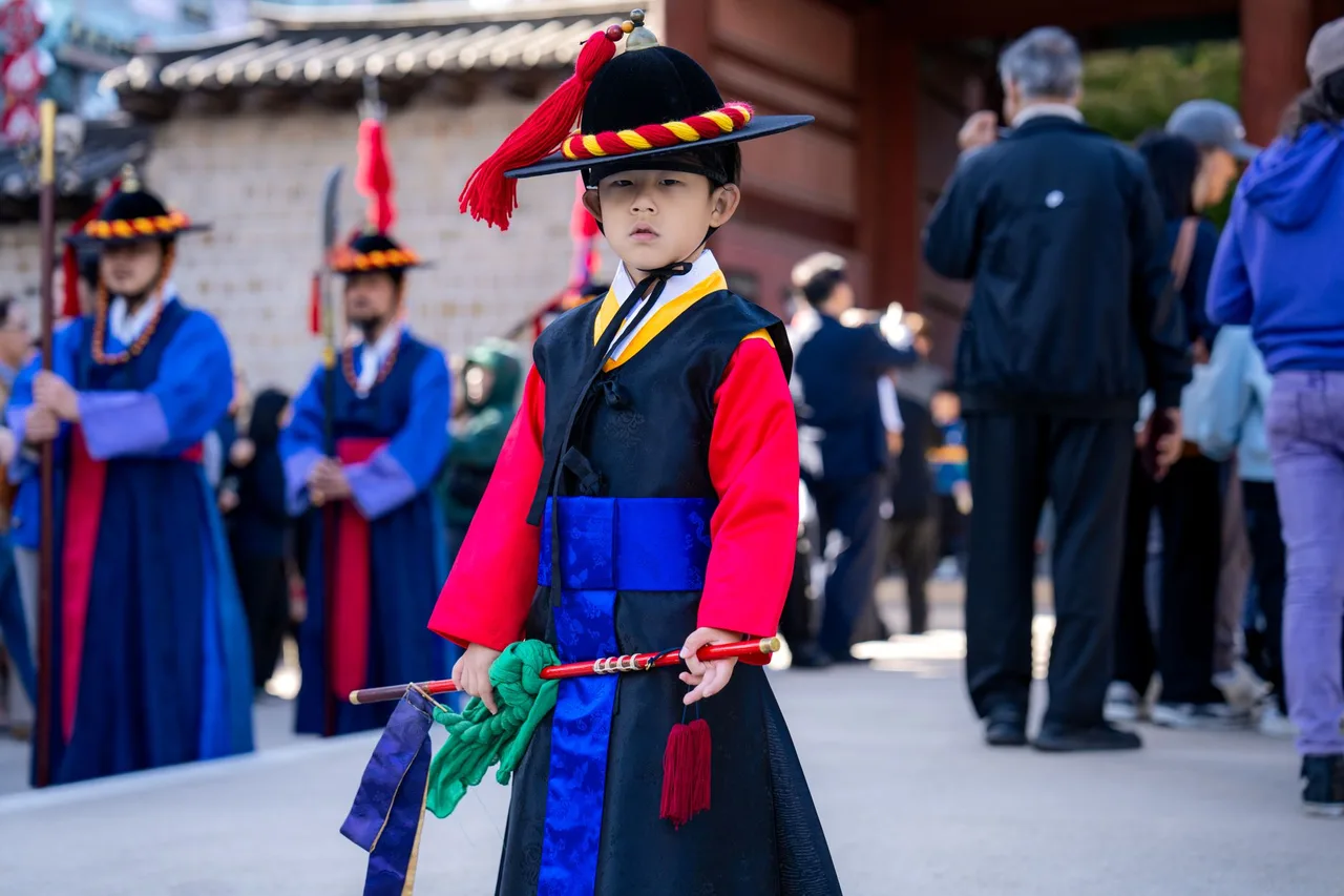 Children in hanbok performing sebae, the deep New Year bow to elders
